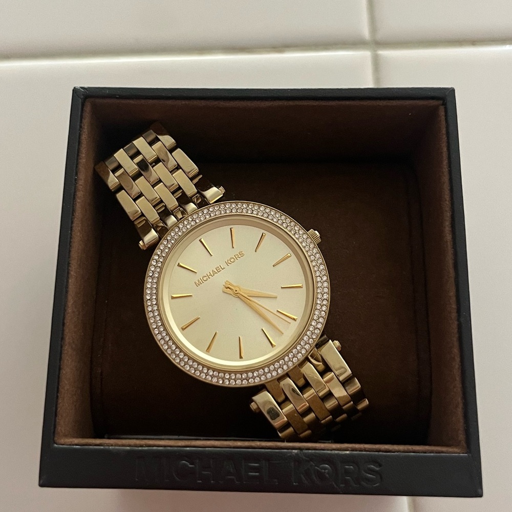 Michael Kors women’s gold and diamond watch